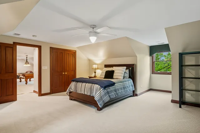 a living room with furniture and a lamp