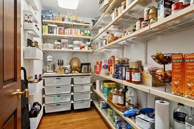 a view of entryway with wooden floor and door