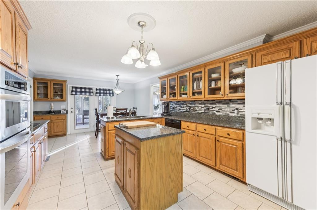 3415 South View Trail Gainesville, GA 30506 - Photo 13 of 65 a kitchen with stainless steel appliances granite countertop a sink and cabinets