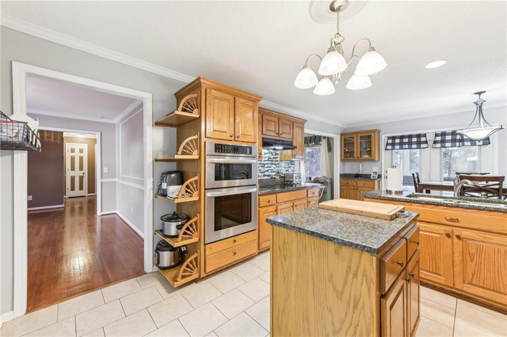 3415 South View Trail Gainesville, GA 30506 - Photo 14 of 65 a kitchen with stainless steel appliances granite countertop a sink and cabinets