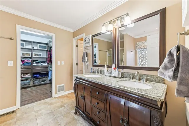 a bedroom with a bed dresser and a window