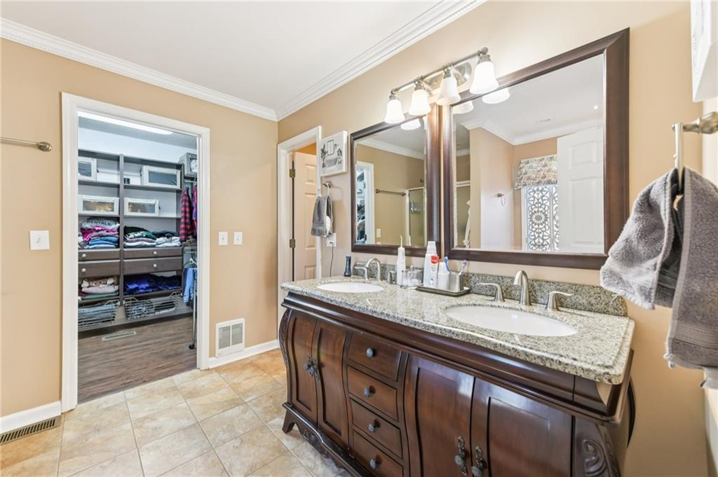 3415 South View Trail Gainesville, GA 30506 - Photo 24 of 65 a spacious bathroom with a granite countertop sink and a mirror
