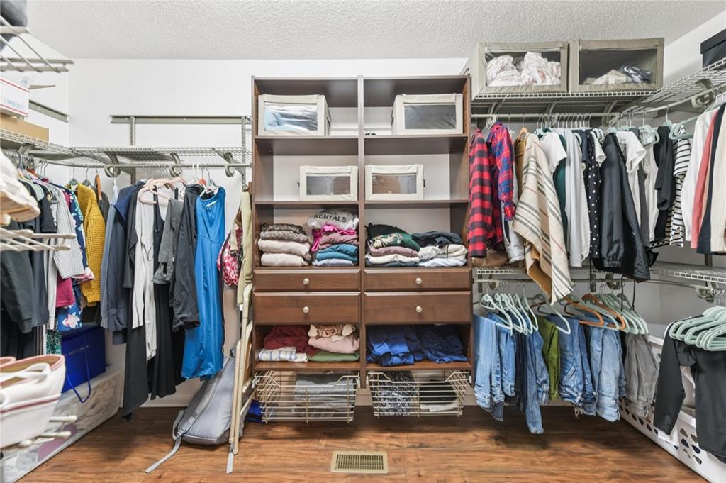 3415 South View Trail Gainesville, GA 30506 - Photo 26 of 65 a view of walk in closet with clothes and shoes