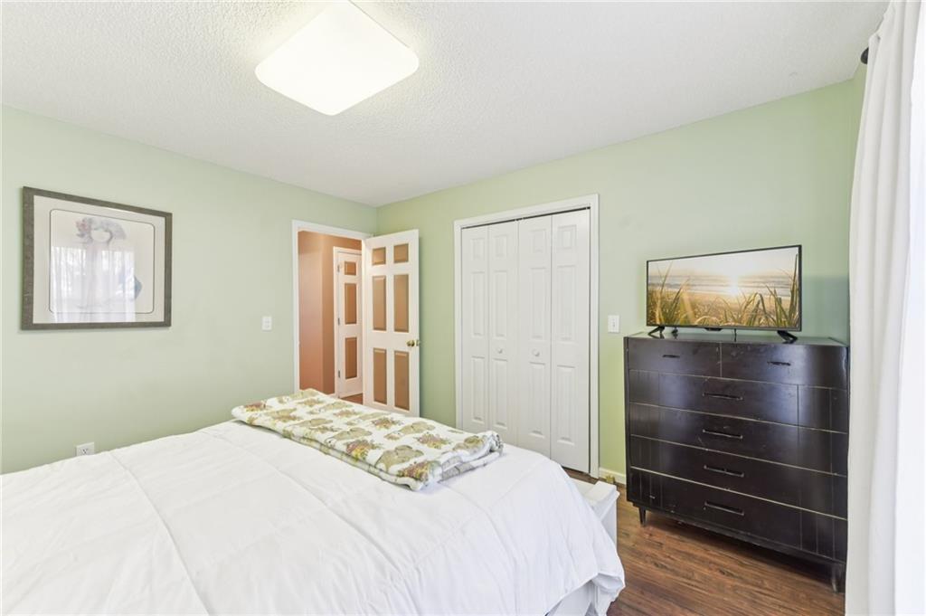 3415 South View Trail Gainesville, GA 30506 - Photo 30 of 65 a bedroom with a bed and a dresser