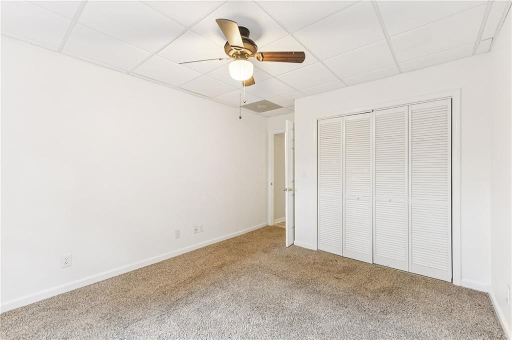 3415 South View Trail Gainesville, GA 30506 - Photo 39 of 65 an empty room with a ceiling fan and a window