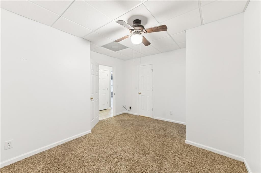 3415 South View Trail Gainesville, GA 30506 - Photo 41 of 65 an empty room with a ceiling fan and wooden floor