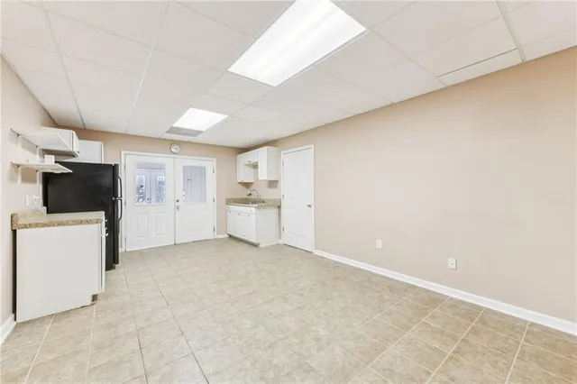 a living room with furniture and a ceiling fan