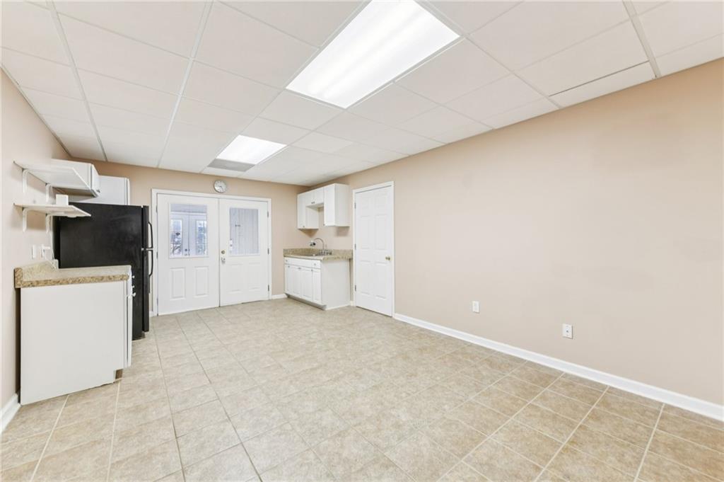 3415 South View Trail Gainesville, GA 30506 - Photo 43 of 65 a view of a kitchen with a sink and a refrigerator