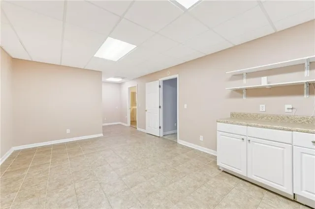 a kitchen with stainless steel appliances granite countertop a sink and a refrigerator