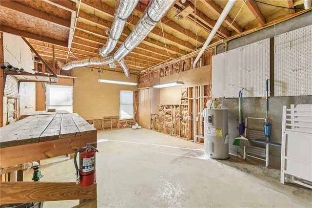 a view of a white house with a yard