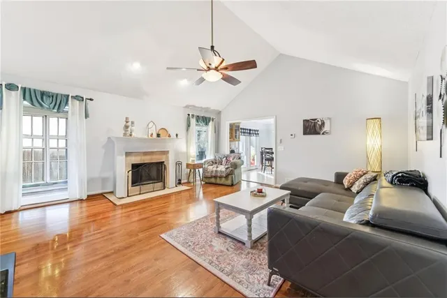 a view of a dining room with furniture and chandelier