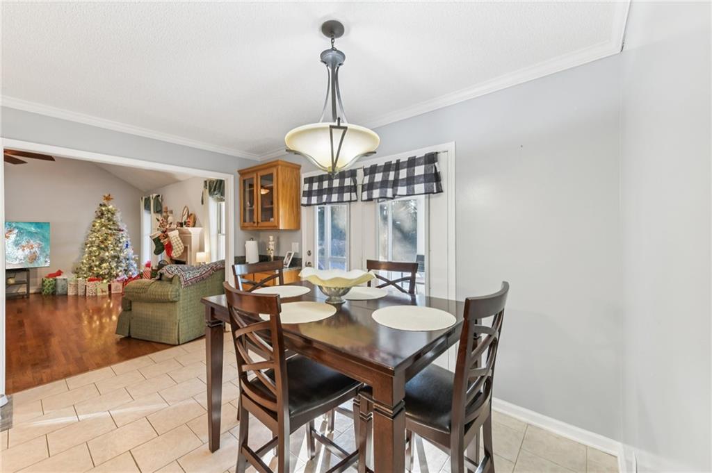 3415 South View Trail Gainesville, GA 30506 - Photo 10 of 65 a view of a dining room with furniture window and wooden floor
