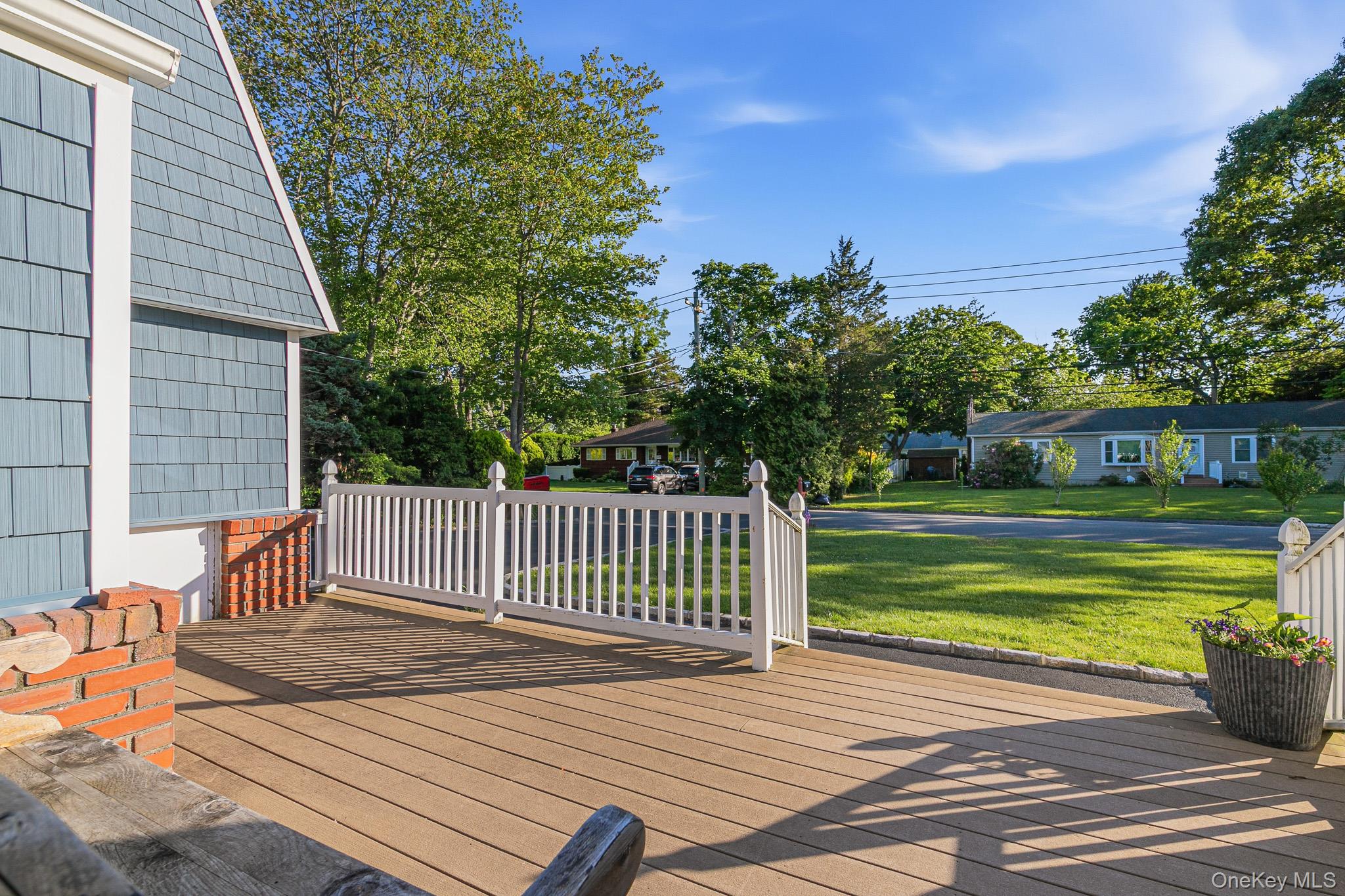 33 Lillian Road Nesconset, NY 11767 - Photo 4 of 42 Greeted By A Large Composite/Trex Front Porch With PVC Railings. Perfect For Outdoor Furniture & Welcoming Family, Friends & Guests.