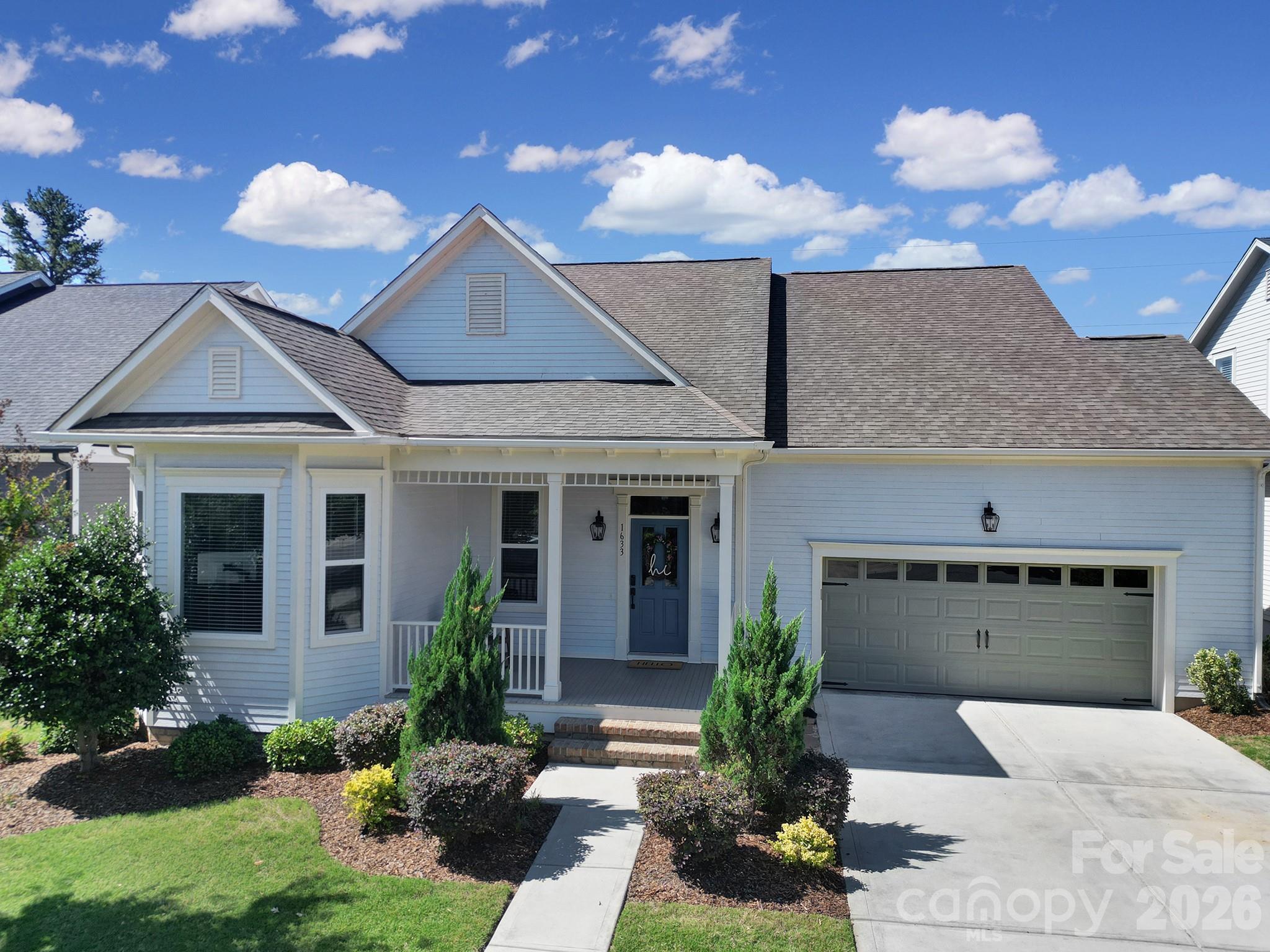 1633 Half Pint Loop Fort Mill, SC 29708 - Photo 1 of 48 a front view of a house with a garden and plants