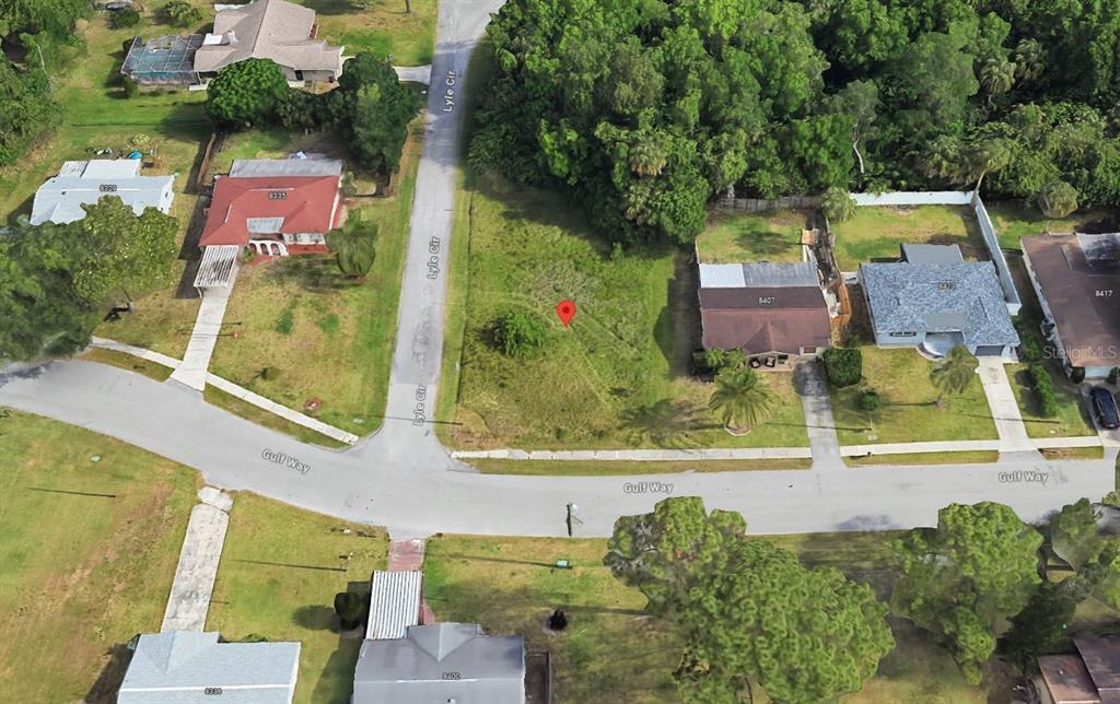 8501 Gulf Way Hudson, FL 34667 - Photo 2 of 10 an aerial view of a houses with outdoor space