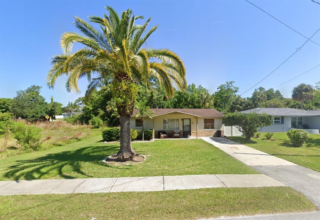 8501 Gulf Way Hudson, FL 34667 - Photo 7 of 10 a view of a house with a yard