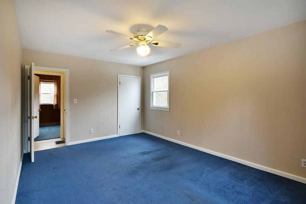 751 Fowler Road Northbridge, MA 01534 - Photo 12 of 32 a view of an empty room with a chandelier fan