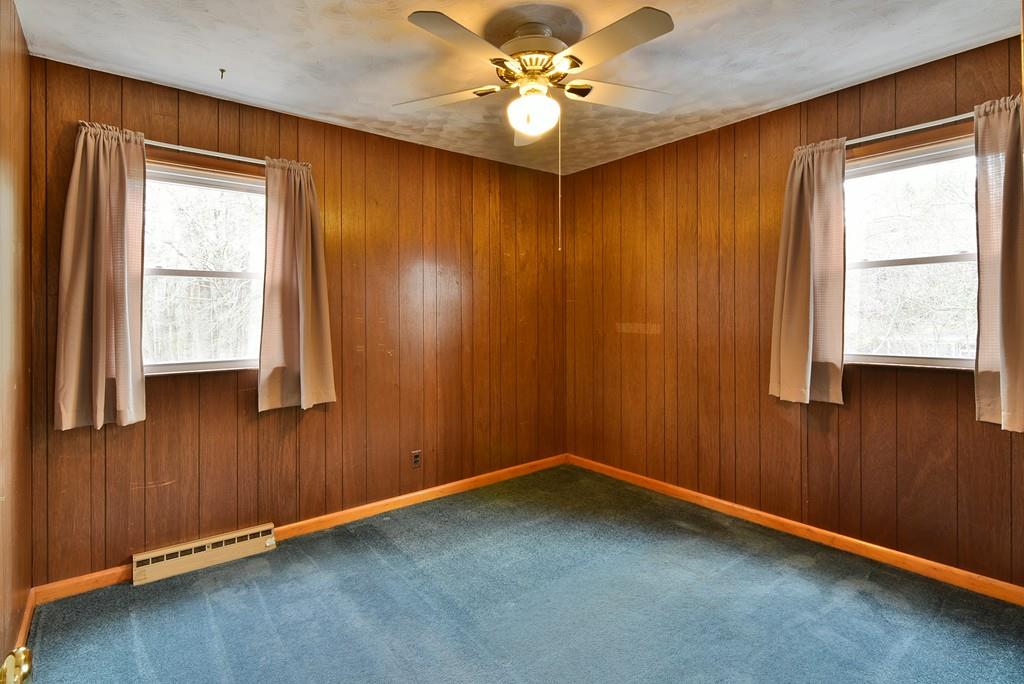751 Fowler Road Northbridge, MA 01534 - Photo 13 of 32 an empty room with a window and a fan