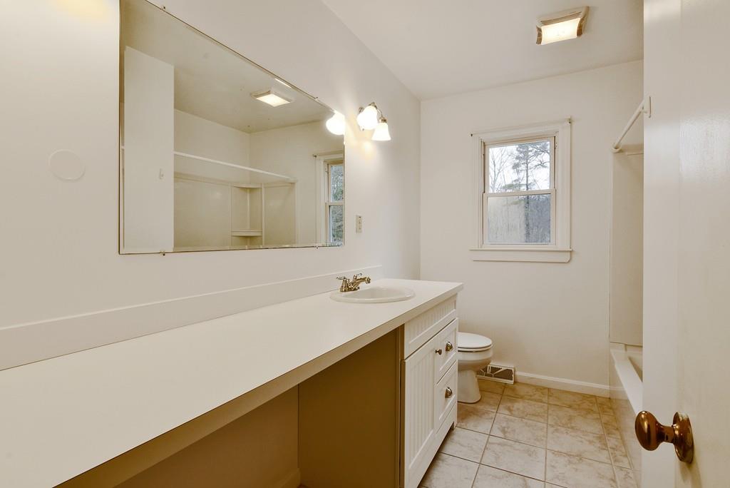 751 Fowler Road Northbridge, MA 01534 - Photo 14 of 32 a bathroom with a sink a toilet and mirror