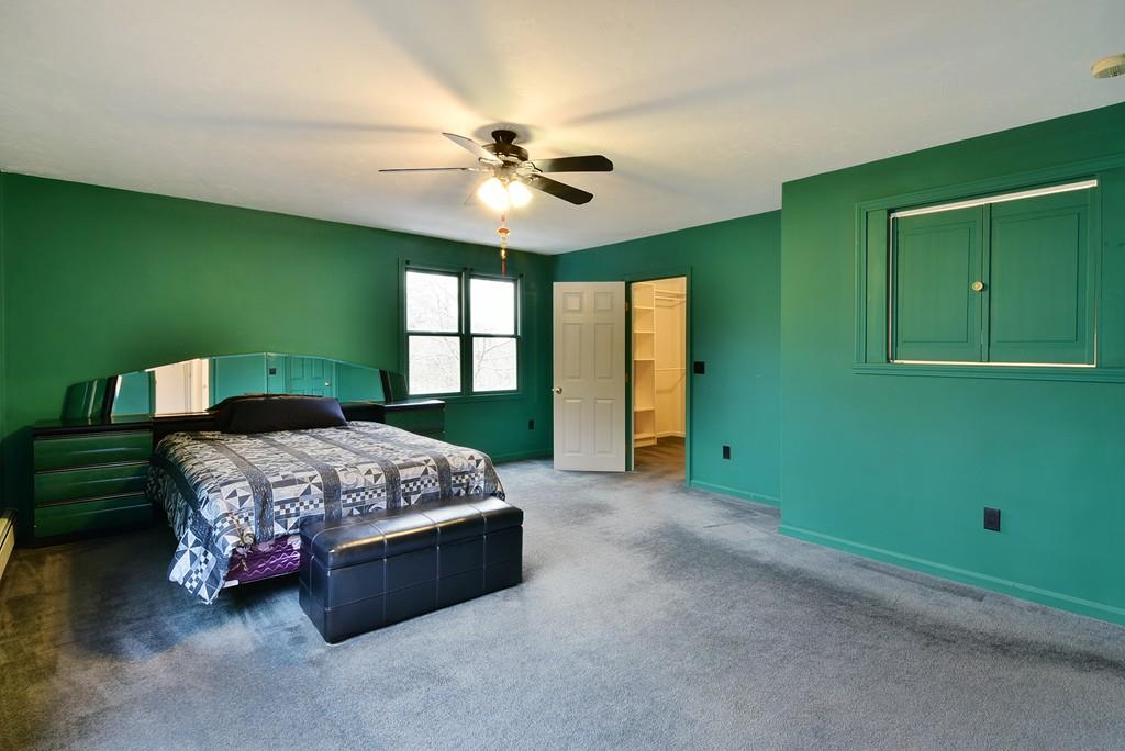 751 Fowler Road Northbridge, MA 01534 - Photo 19 of 32 a spacious bedroom with a bed and a window