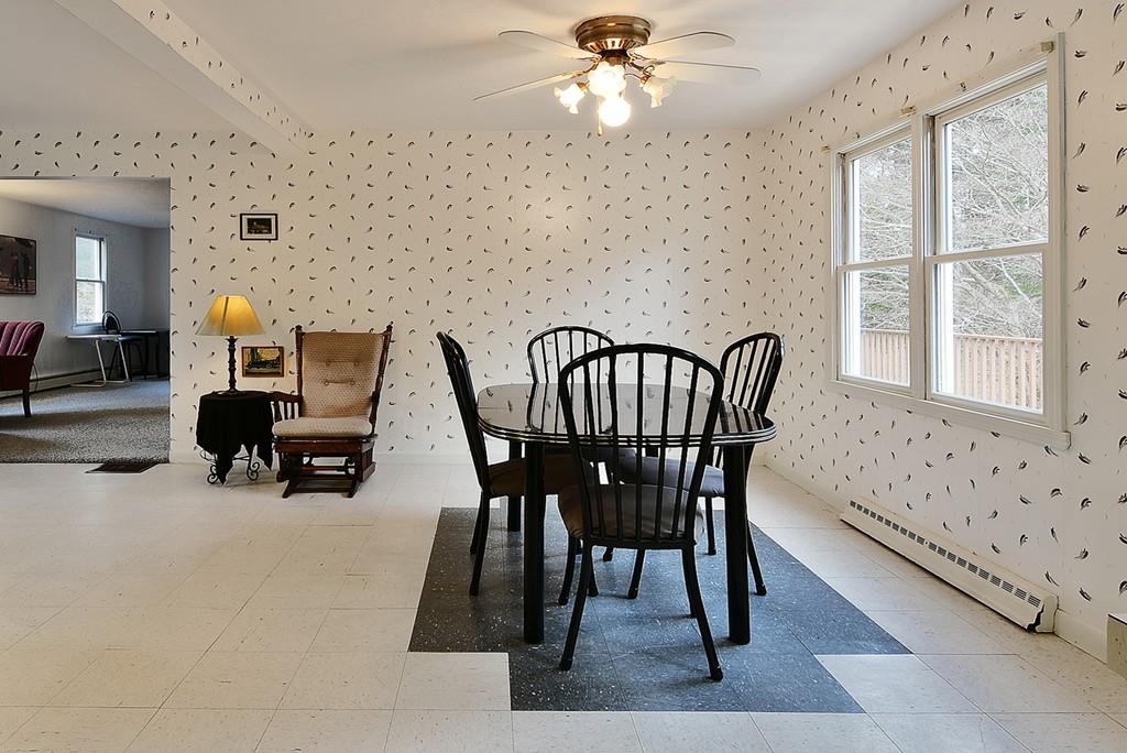 751 Fowler Road Northbridge, MA 01534 - Photo 6 of 32 a view of a dining room with furniture and chandelier