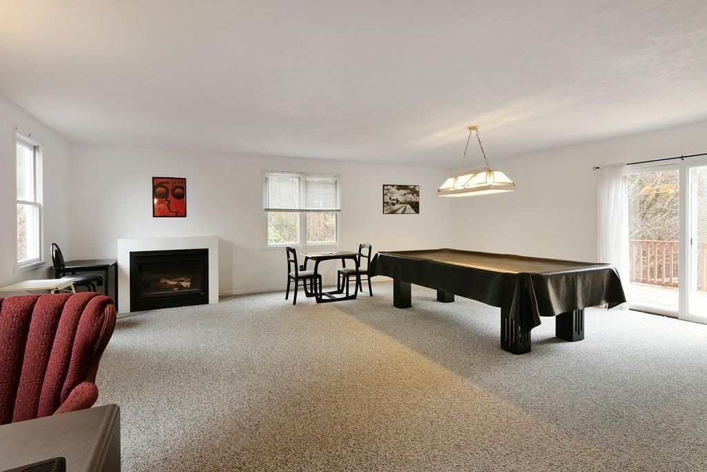 751 Fowler Road Northbridge, MA 01534 - Photo 9 of 32 a living room with furniture and a fireplace