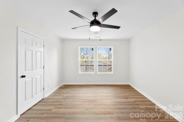 808 3rd Street Kings Mountain, NC 28086 - Photo 20 of 24 wooden floor in an empty room with a window