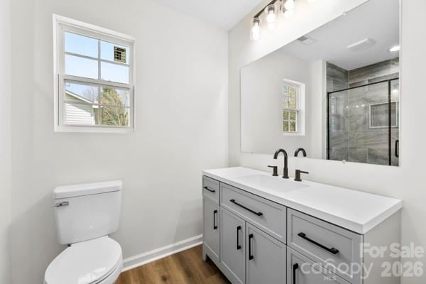 808 3rd Street Kings Mountain, NC 28086 - Photo 21 of 24 a bathroom with a toilet sink and mirror