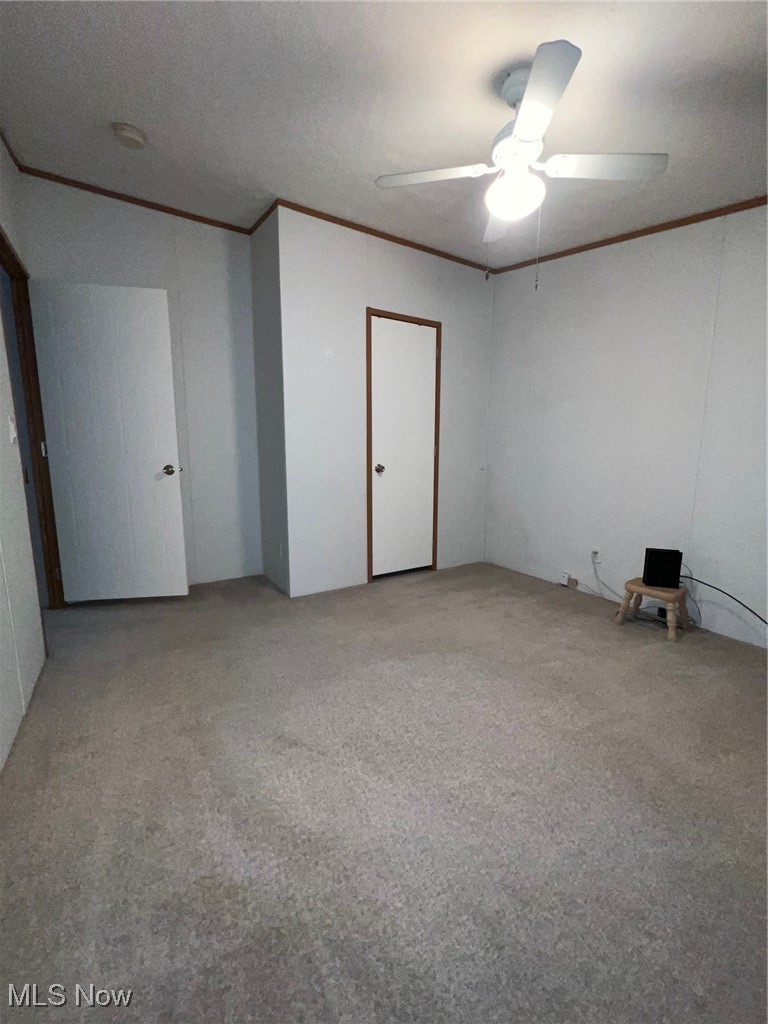 7716 Depot Road, Unit 7 Lisbon, OH 44432 - Photo 13 of 21 Unfurnished bedroom with carpet and ceiling fan