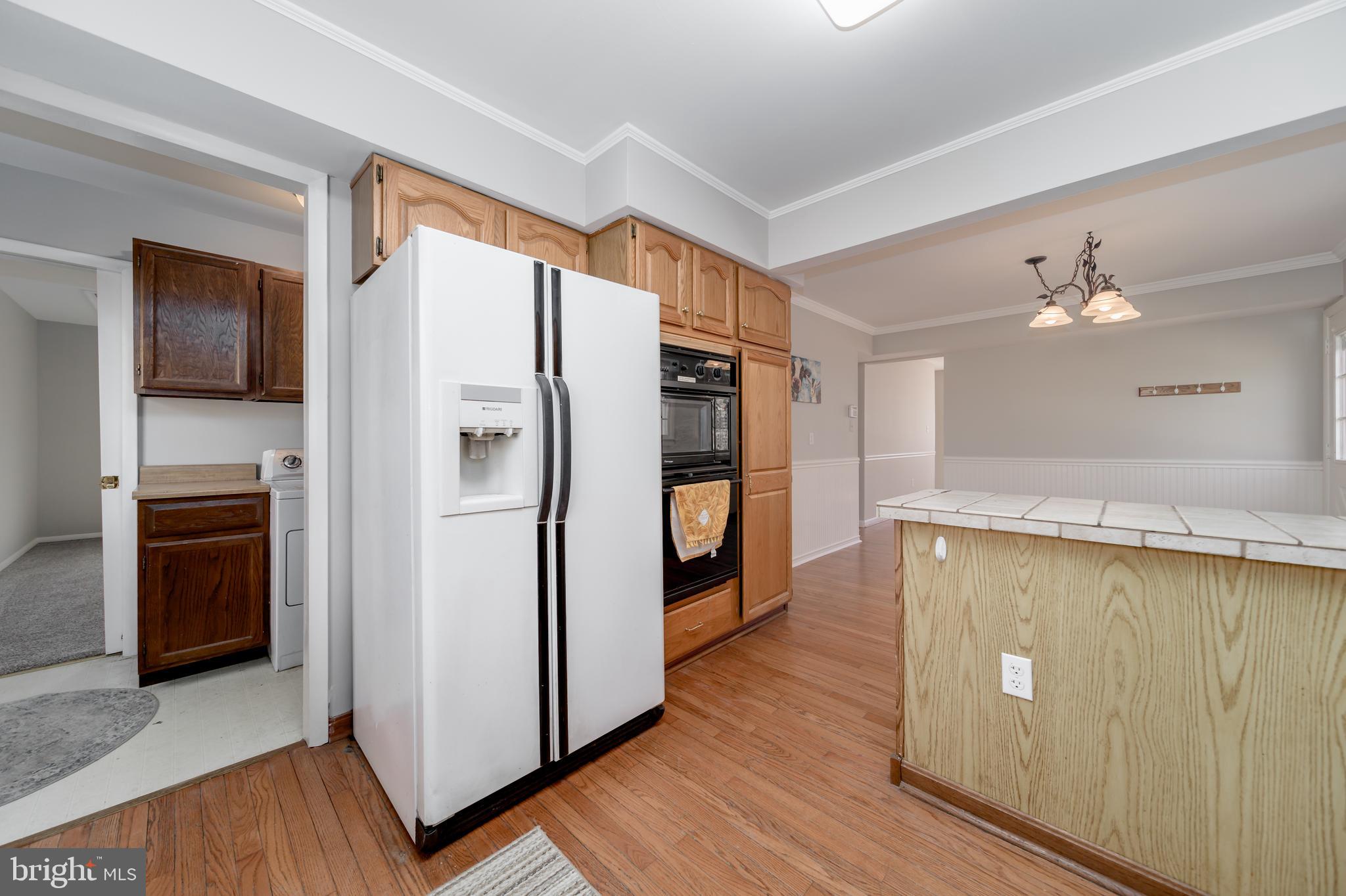 115 West Mount Harmony Road Owings, MD 20736 - Photo 8 of 29 Kitchen, Laundry Room, Back Deck Access