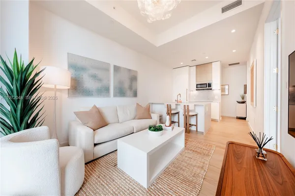 a living room with furniture and a table
