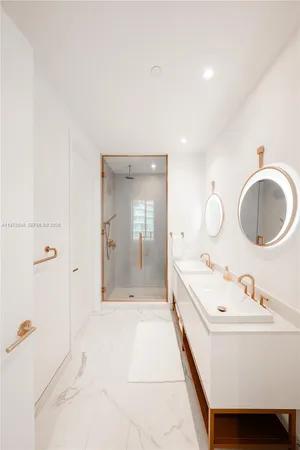 a spacious bathroom with a tub sink and mirror