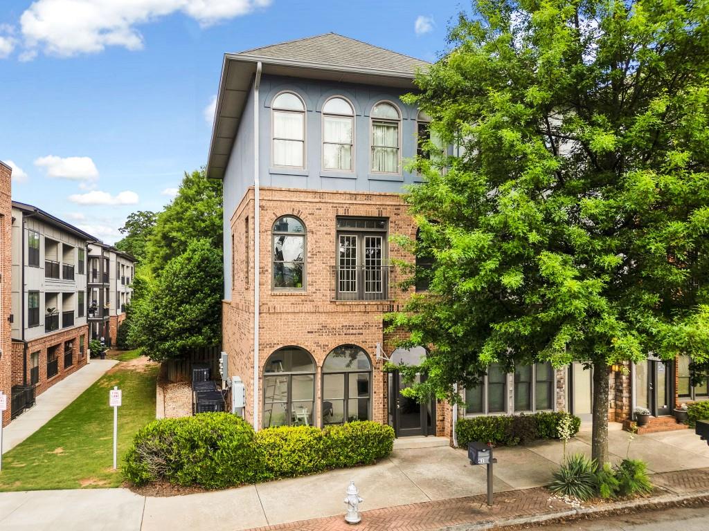 41 Howard Street Southeast Atlanta, GA 30317 - Photo 1 of 1 a front view of a house with a garden
