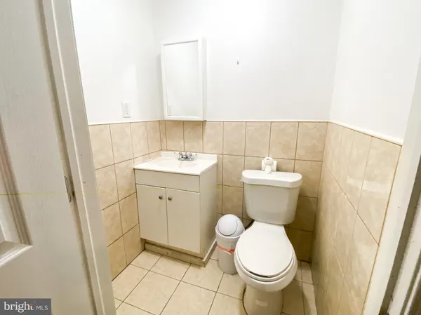 a bathroom with a toilet and a sink