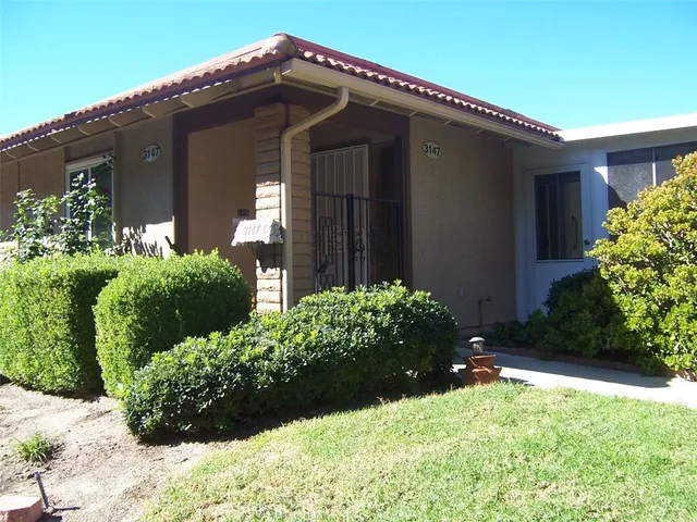 a front view of house with a yard