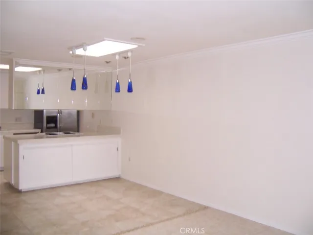 a room with a sink and a mirror