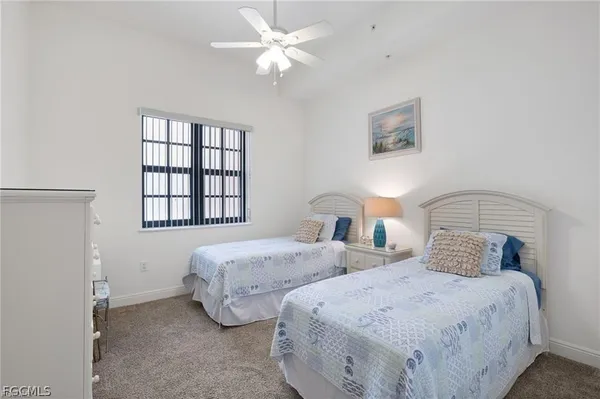 a living room with furniture a dining table and a fireplace