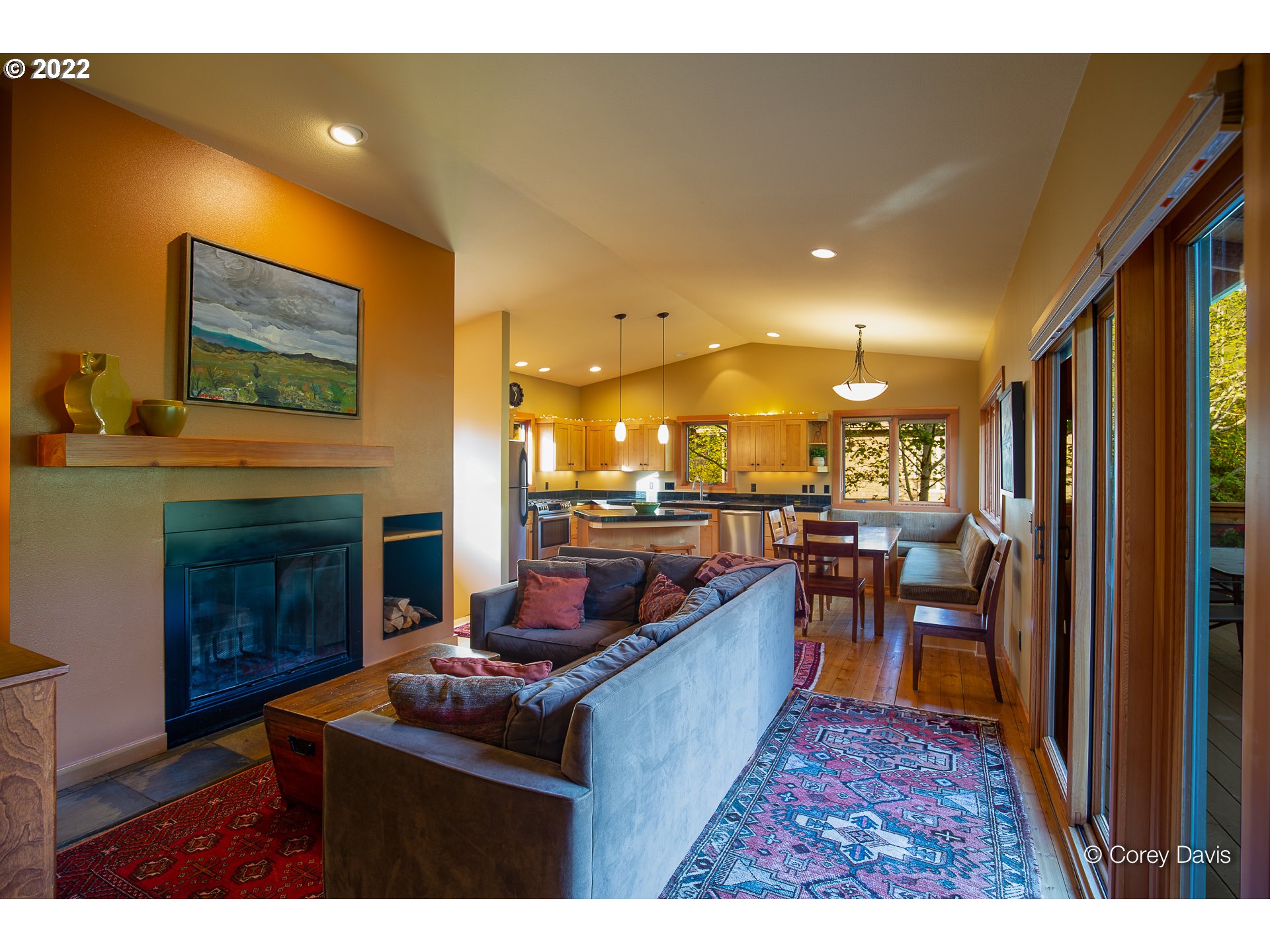8185 Nehalem Road Manzanita, OR 97130 - Photo 17 of 31 a living room with furniture a fireplace and a flat screen tv