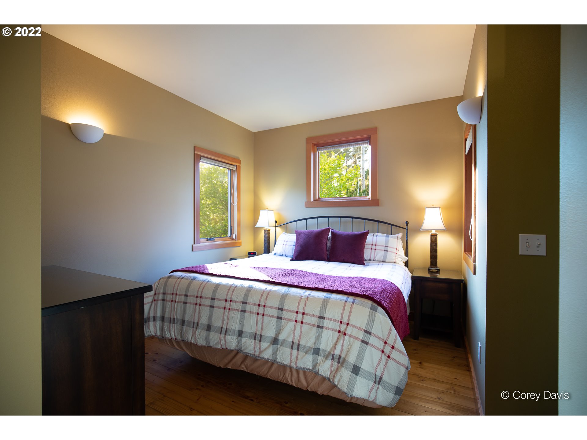 8185 Nehalem Road Manzanita, OR 97130 - Photo 21 of 31 a bedroom with a bed and a window