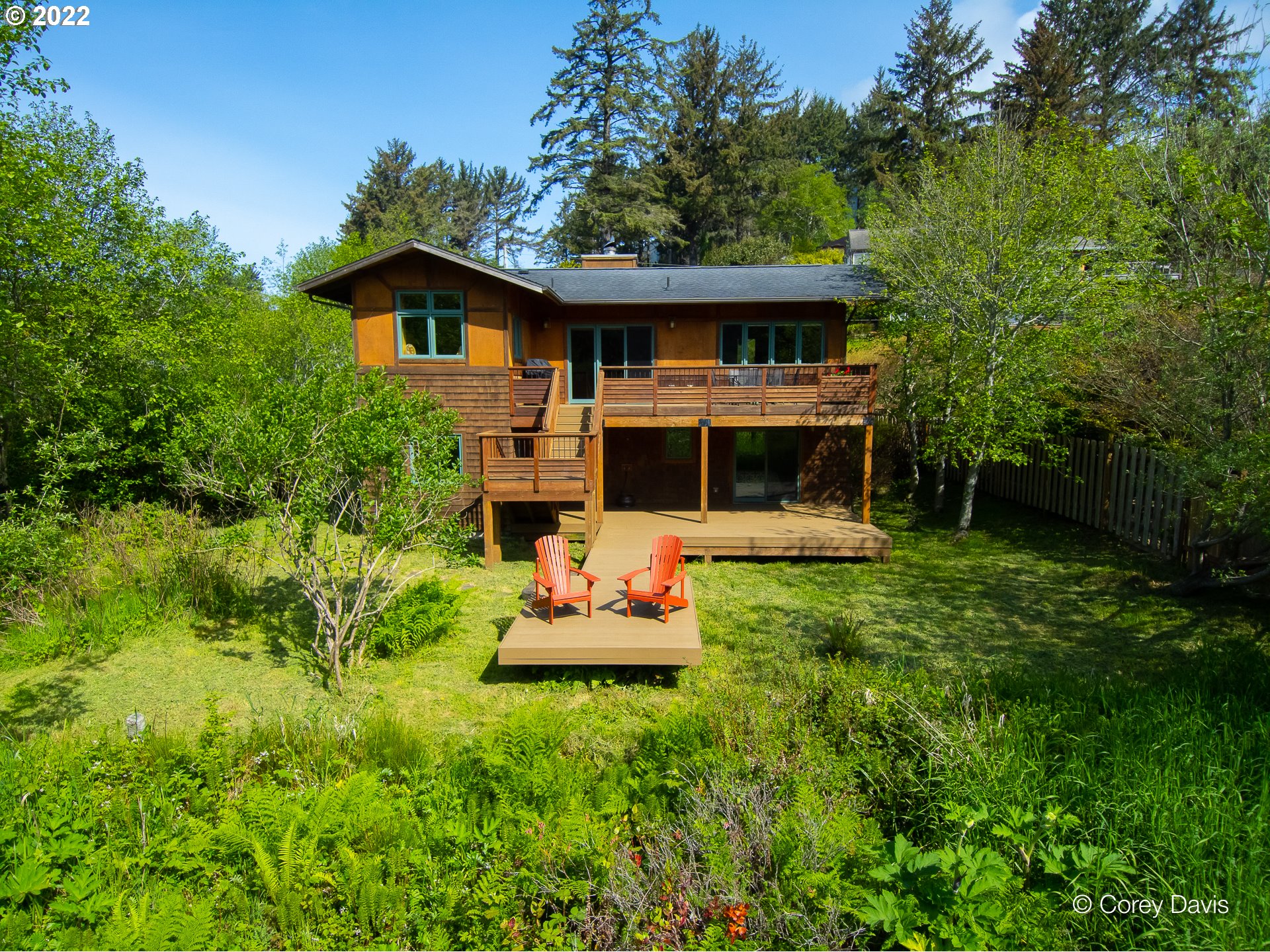 8185 Nehalem Road Manzanita, OR 97130 - Photo 4 of 31 a front view of a house with a yard