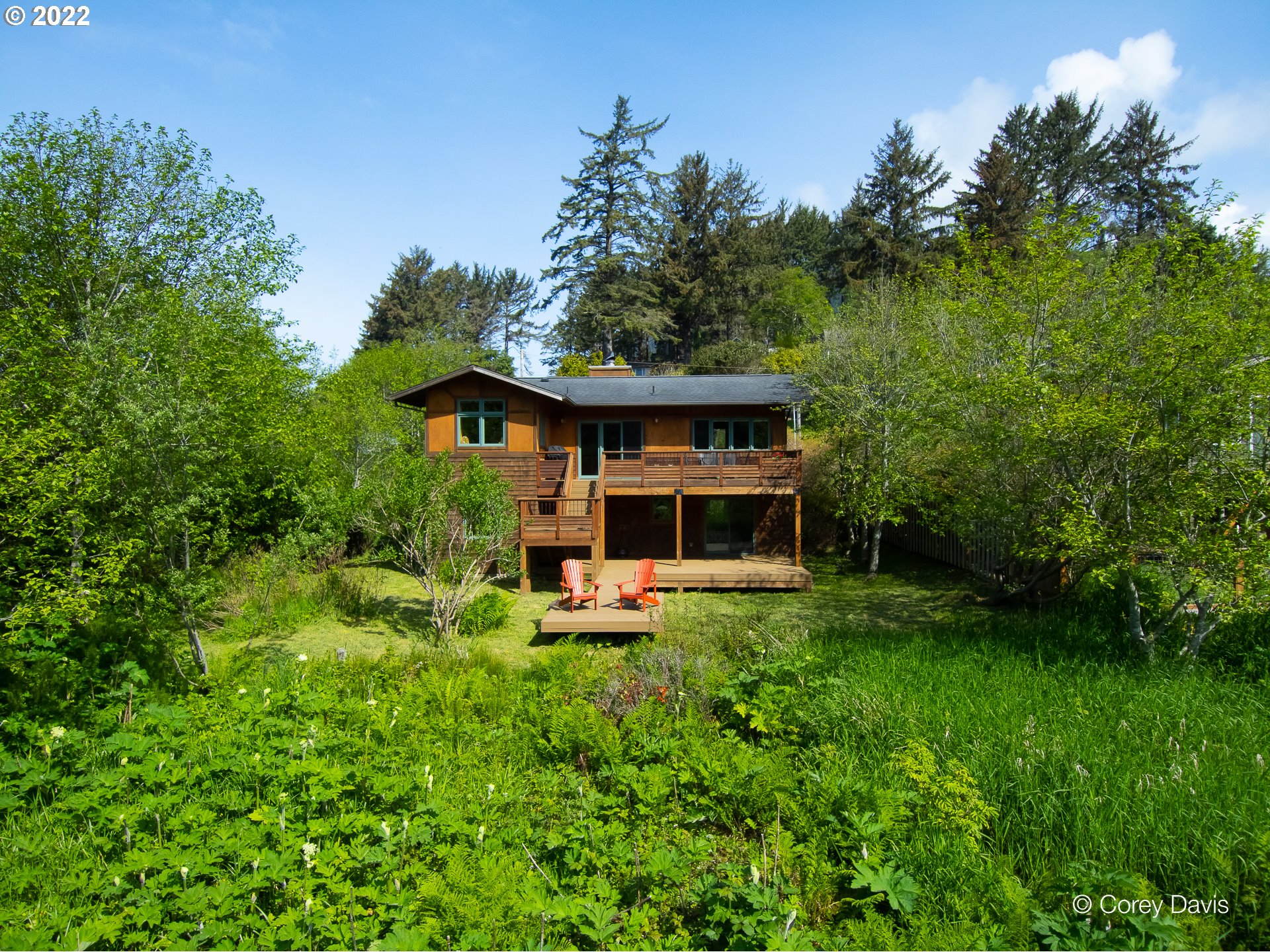 8185 Nehalem Road Manzanita, OR 97130 - Photo 5 of 31 a front view of a house with a yard