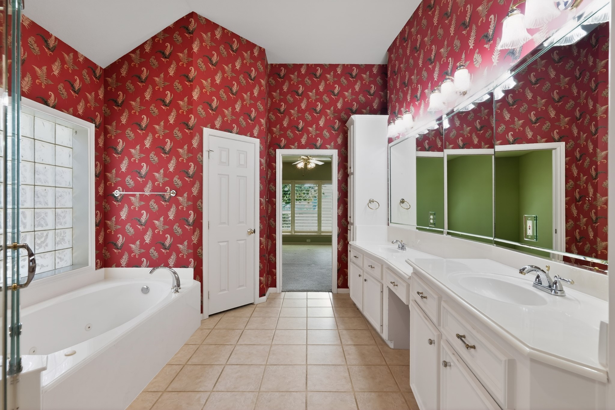 20714 Flora View Court Spring, TX 77379 - Photo 28 of 40 a bathroom with a double vanity sink mirror and bathtub