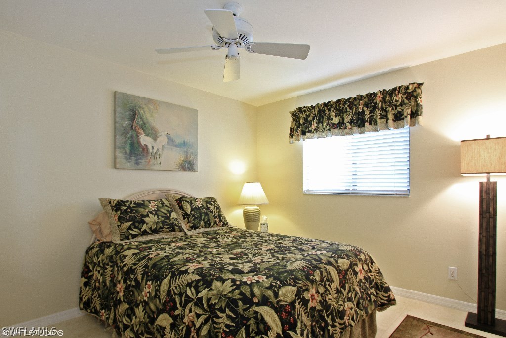 13266 Heather Ridge Loop Fort Myers, FL 33966 - Photo 8 of 12 a bed sitting in a bedroom next to a window