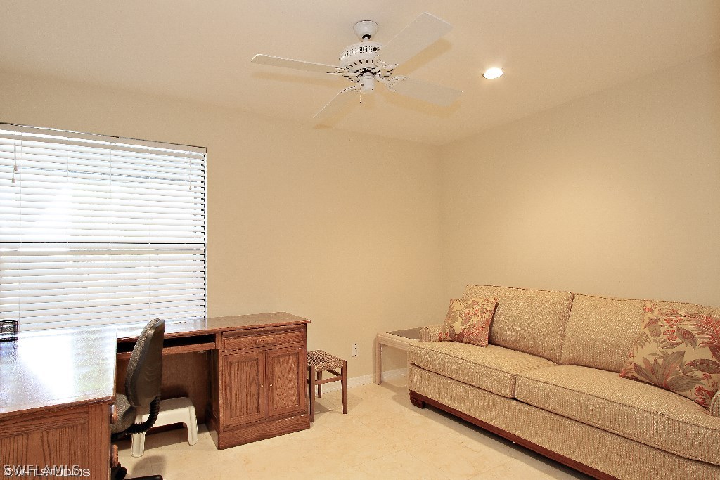 13266 Heather Ridge Loop Fort Myers, FL 33966 - Photo 10 of 12 a living room with furniture and a window