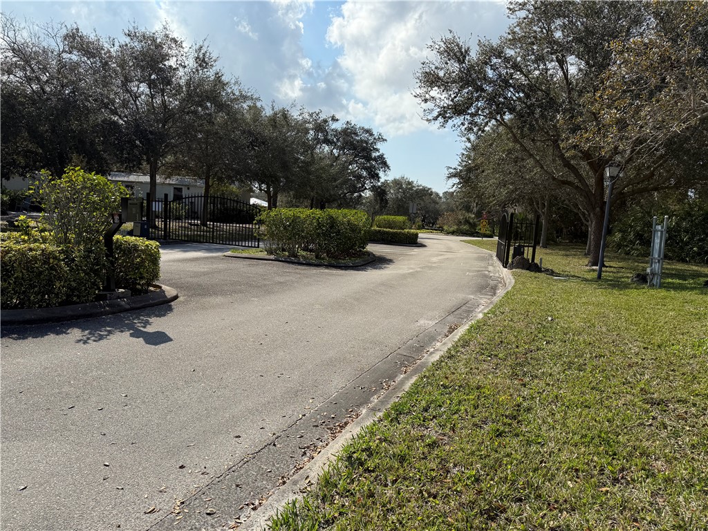 11331 Ganesh Way Sebastian, FL 32958 - Photo 3 of 6 a view of a backyard with a garden