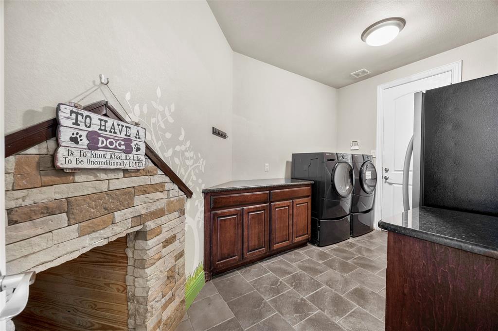 219 Mohundro Road Ferris, TX 75125 - Photo 32 of 40 a room with storage and utility