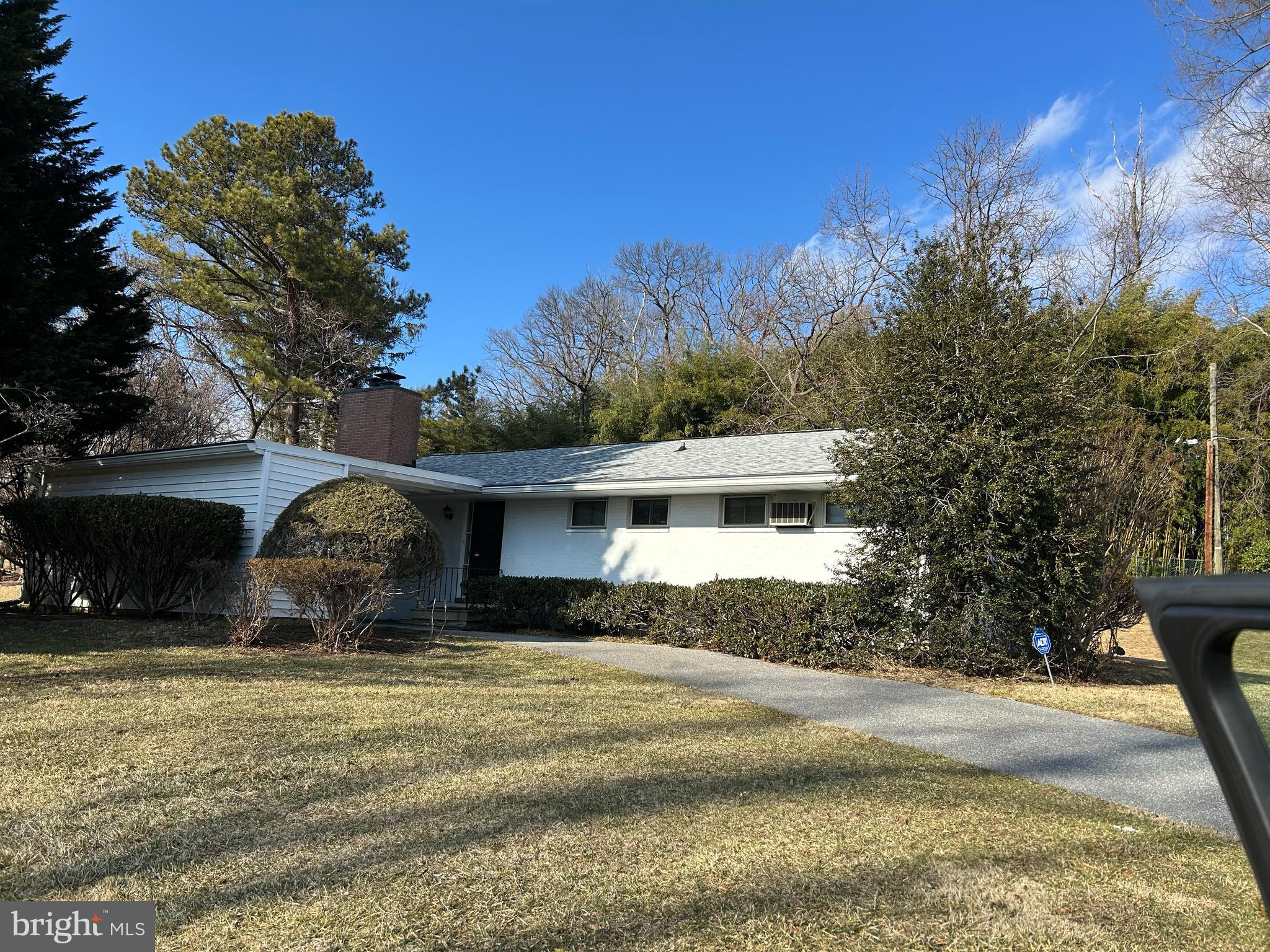 1306 Pine Ridge Lane Baltimore, MD 21208 - Photo 1 of 1 a front view of a house with a yard