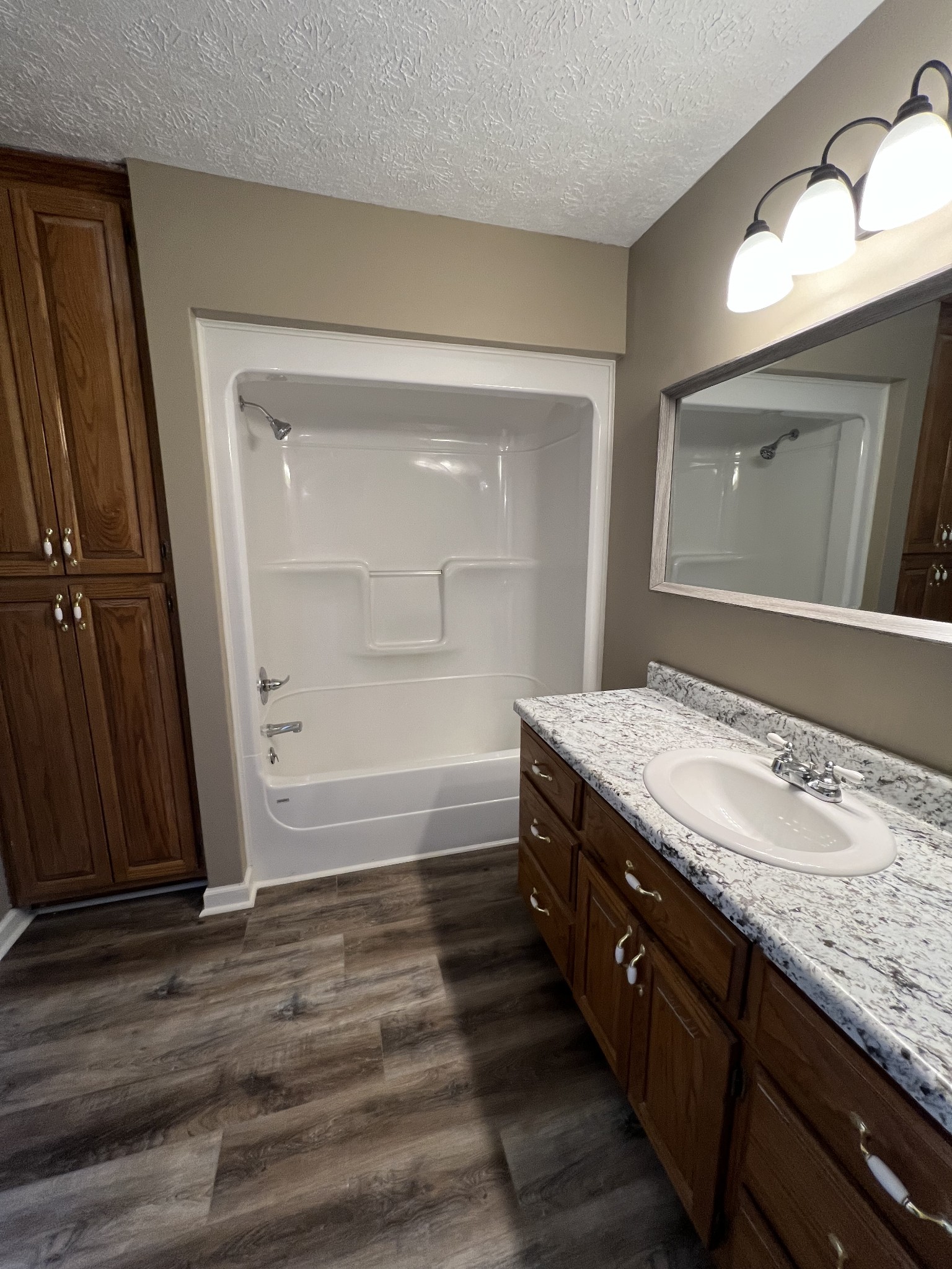 1109 W Road Red Boiling Springs, TN 37150 - Photo 6 of 14 a bathroom with a granite countertop sink mirror and vanity