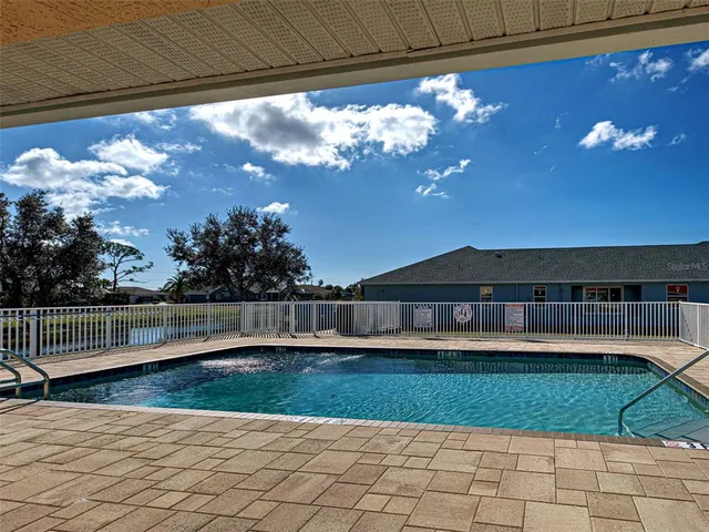 a view of a patio with a bench
