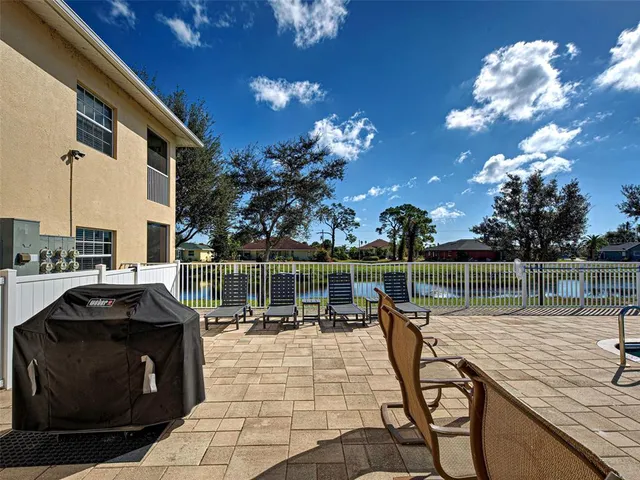 a view of swimming pool with seating area
